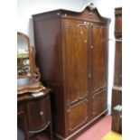 An Early XX Century Two Door Mahogany Wardrobe, with a swan neck pediment, twin doors, with