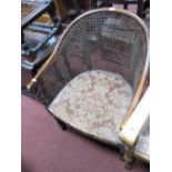 A 1920's Chair, with a caned back, drop in seat, on barley twist and block supports, united by
