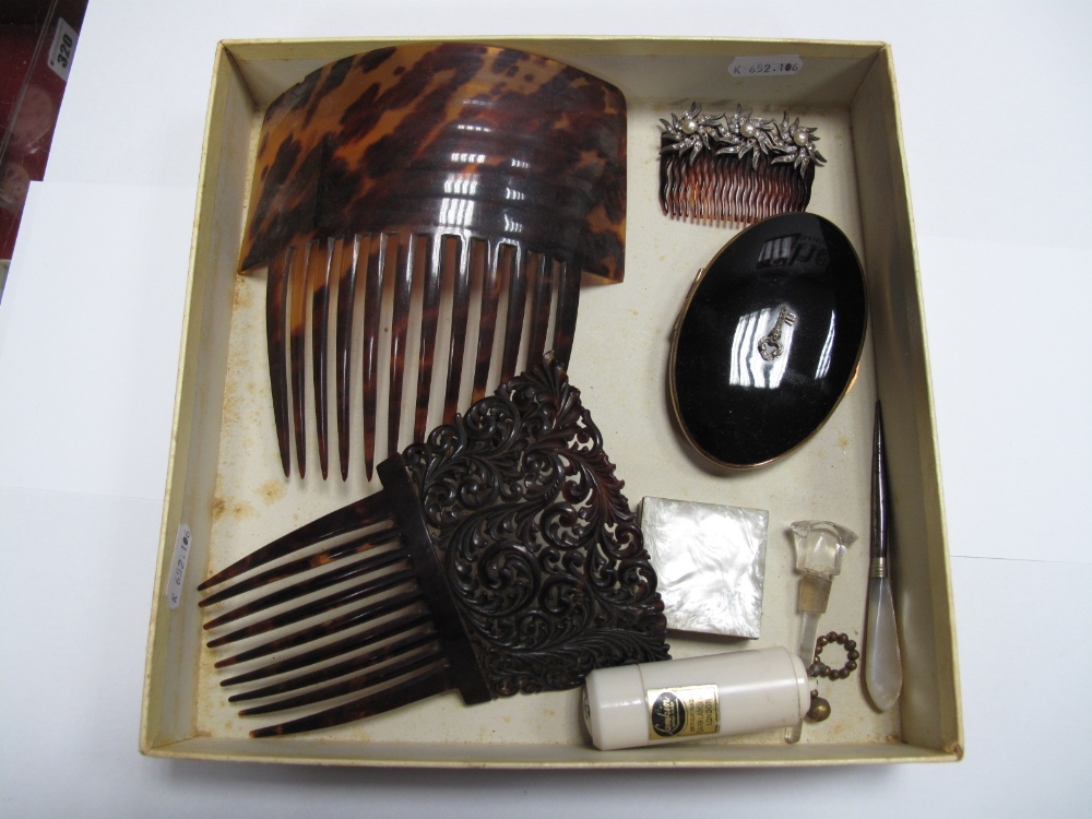 Two Large Tortoiseshell Hair Combs, one leaf scroll carved; an oval powder compact, smaller hair