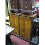 A Reproduction Mahogany Music Cabinet, compartmentalised interior, with supplier's label verso '