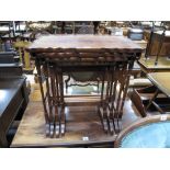 A XX Century Mahogany Quartetto Nest of Tables, with a shaped moulding on turned and block