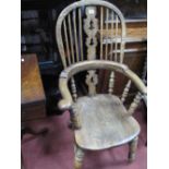 A Mid XIX Century Ash and Elm Pad Arm Windsor Chair, with hooped back and pierced splat, turned