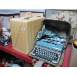 A Portable Bluebird Typewriter, together with a New-Home electric sewing machine. (2)