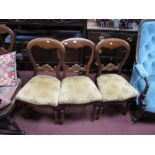A Set of Four Victorian Mahogany Balloon Back Dining Chairs, carved and scrolled mid rail,