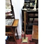 Brass Standard Lamp, in the form of a Corinthian column, square base, paw feet.