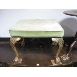 An XVIII Century Style Stool, with a rectangular upholstered top, on walnut carved cabriole legs.
