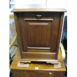 An Early XX Century Walnut Purdonium, top with a moulded edge, carrying handles, panelled fall