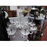 A Crystal Electric Chandelier, with faceted lustre drops and drip cups, suspending from ten twist