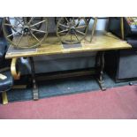 An Oak Refectory Style Table, rectangular top with stretchered trestle ends.