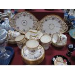 A Late XIX Century Tea Service, decorated with floral swags and gilt highlighted, comprising two