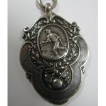 A Hallmarked Silver Medallion Pendant, detailed in relief to the front with a footballer, the
