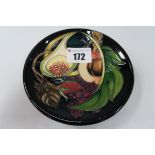 A Moorcroft Pottery Coaster, decorated in the Queen's Choice design by Emma Bossons, shape 780/4,