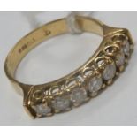 An 18ct Gold Seven Stone Diamond Half Eternity Style Ring, claw set throughout with uniform stones.