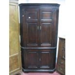 An XVIII Century Painted Pine Double Height Corner Cupboard, with dentil cornice, panelled doors and