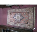 A XX Century Persian Style Silk Prayer Rug, pink ground, geometric decoration, 55 x 95cm.