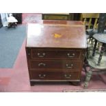 An Edwardian Mahogany Bureau, with a crossband top, fall front with shell inlay, fitted interior,