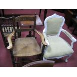 A White Painted French Style Armchair, with floral carving, moquette seat and back; oak armchair