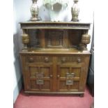 An Oak Court Cupboard, with allover poker work carving, upper door, cup and cover supports, twin