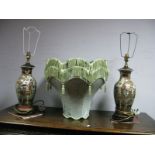 A Pair of Chinese Pottery Table Lamps, each with wooden base and green damask shade.