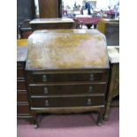 Walnut Bureau Circa Mid XX Century, with fall front, fitted interior, three drawers, over cabriole