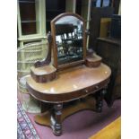 A Victorian Mahogany Duchess Dressing Table, central mirror with shaped supports and trinket