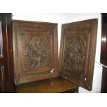 A Pair of XIX Oak Continental Paneled Cupboard, doors with carved and raised decoration of