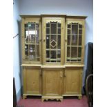 A Pine Break Front Cabinet, dentil cornice over triple glazed doors, with interior shelving, each