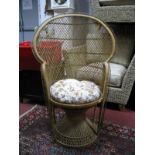 A XX Century Wicker Chair, with a hooped back, on a circular base.