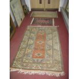 A Turkish Allover Geometric Wool Rug, with rectangular centre, 183 x 122cm. Another smaller (both
