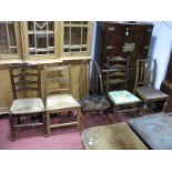 An Ercol Dark Elm Stick Back Dining Chair, a Country rush seated ladder back chair and three other