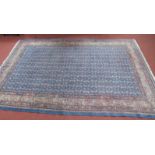 An Iranian Orient-Teppich Fringed Rug, all over geometric decoration on a blue field, within multi