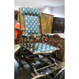 A Late XIX Century American Rocking Chair, with upholstered back panel, arms and seat on rockers,