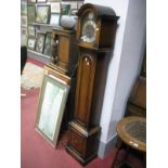 An Oak Cased Grandmother Clock, having domes top and Smiths electric movement.