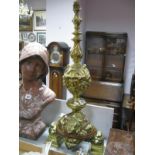 XVII Century Style Brass table lamp, in the form of a candlestick, with scroll and decorated heads.