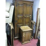 A 1930's Oak Wardrobe, carved linen fold decoration, on castors; together with a pot cupboard and