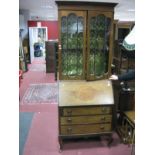 An Edwardian Mahogany Bureau Bookcase, top with glazed doors, two internal shelves, bureau with a