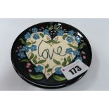 A Moorcroft Pottery Coaster, decorated in the Love design by Kerry Goodwin, shape 780/4, numbered