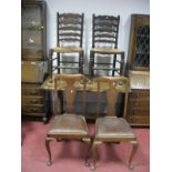 An Oak Refectory Dining Table, two ladder back, and two Queen Anne style chairs.