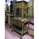 A Mahogany Mechanical Trolley; together with an oak sewing table.