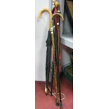 Silver Topped Walking Cane, three others, three umbrellas.