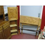 A XX Century Hardwood Hanging Corner Cupboard, the hinged door fascia with low relief carved