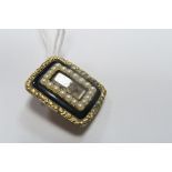 A XIX Century Mourning Brooch, of rectangular form with central glazed hairwork panel, inscribed