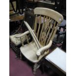 A XIX Century Style Ash Rocking Chair, pierced splat, shaped arms, on turned legs, (Rookers not