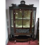 An Edwardian Mahogany Display Cabinet, having pierced and shaped back, canted corners, single glazed