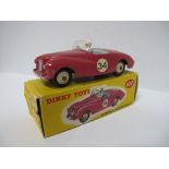A Boxed Dinky Diecast #107 Sunbeam Alpine Sports, deep pink body, grey interior, cream hubs, some