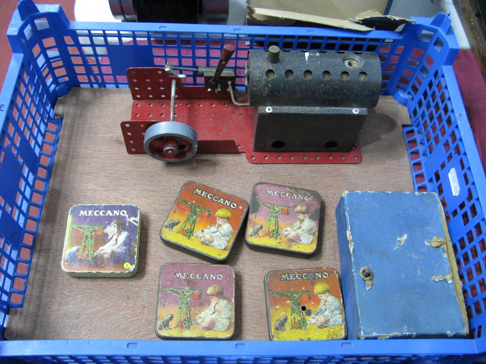 A 1970's Meccano Steam Engine (A/E), plus five pre war Meccano tins and a clockwork motor.