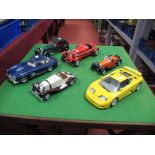 Six Assorted Model Diecast cars In Various Scales, by Burago and others.