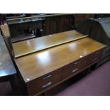 A 1970's Teak Four Heights Chest, with four long drawers, tapering legs, length 145cm.