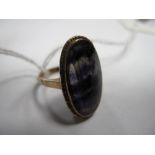 A Blue John Oval Panel Ring, collet set, stamped "9ct".