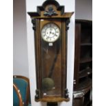 A Circa 1900 Vienna Wall Clock, ebonised arched pediment and foliate motif, white enamel dial, Roman